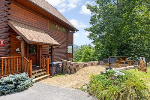 Sevierville House | A Taste Of Honey is a dog-friendly two bedroom true log cabin nestled inside the Starr Crest resort