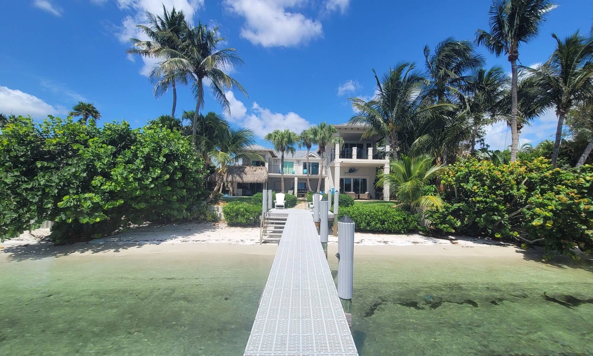 Boynton Beach Villa | A waterfront oasis with soft white sand beach, pool and intracoastal dock views.