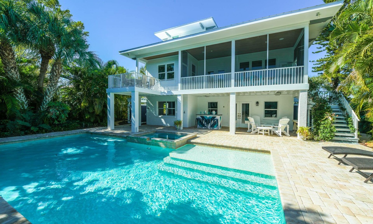 Anna Maria House | Canal front Home with Private Dock, Pool, Games, and Water Adventures