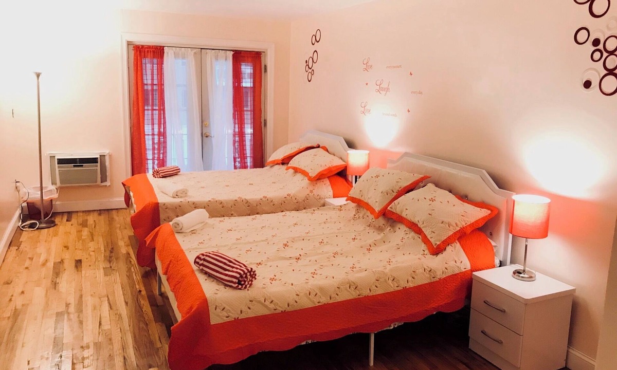 Queens House | Charming 4-bedroom, 2 bath, balcony townhome in Queens