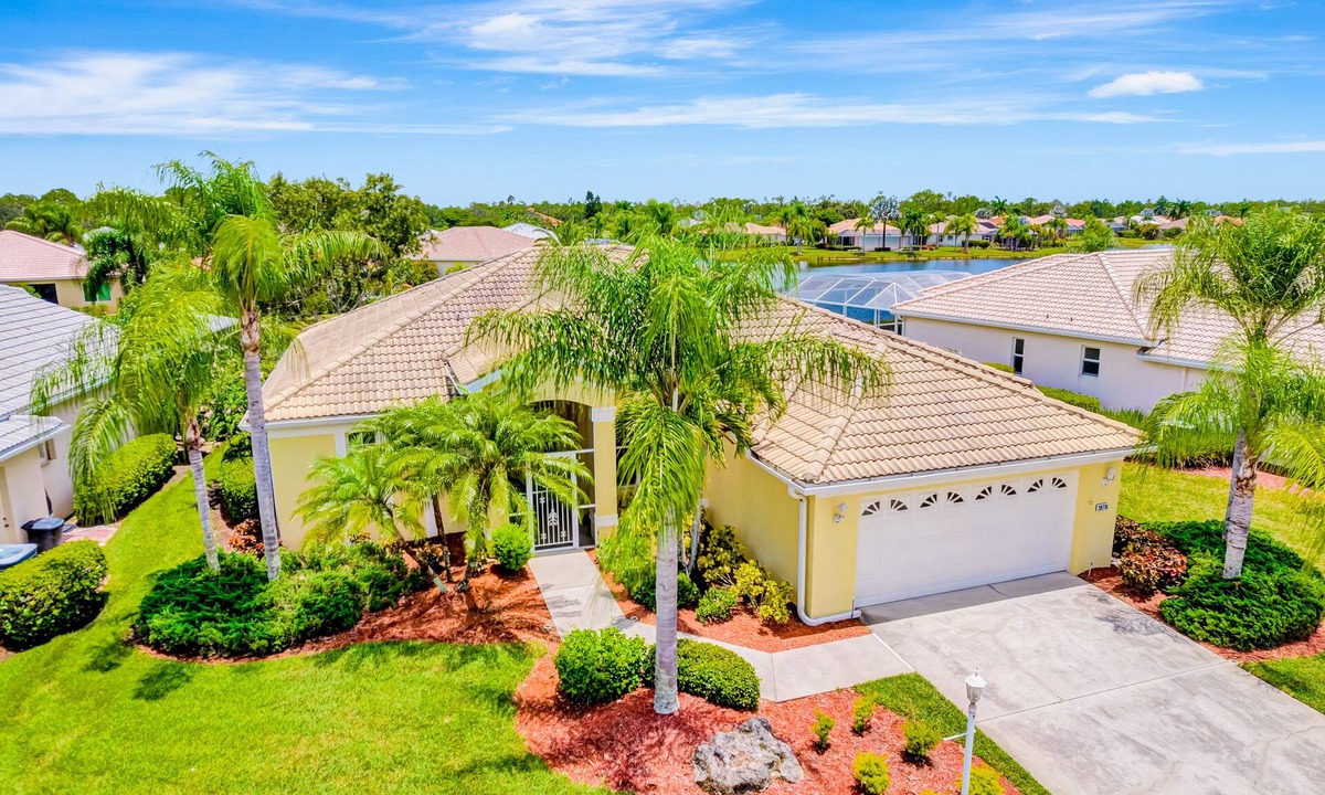 Herons Glen House | Country club retreat with private pool, water views, on-site golf, & gym
