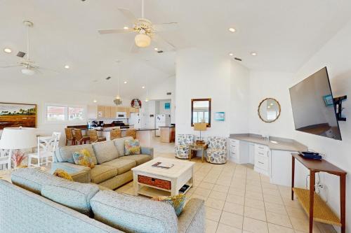 East End House | Dog-friendly beachfront home with private hot tub fireplace on-site pool AC