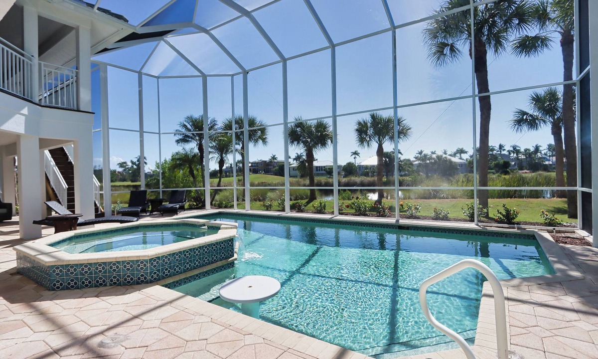 Beachview Country Club Estates House | Exquisite river-view home with heated pool and spa in the expansive lanai
