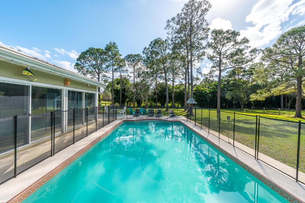 Palm Beach Country Estates Villa | Family Retreat Firepit Htd Pool Massive Yard Sleeps 12