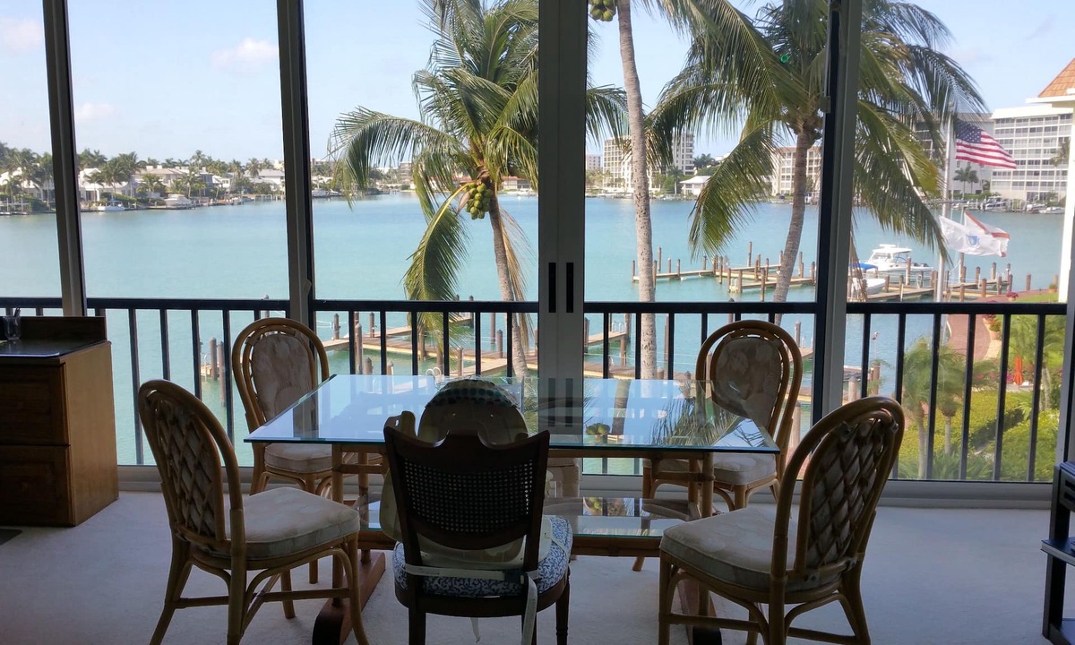 Moorings Condo | Front unit overlooking Moorings bay - 7 min walk to the Beach. 2 boat slips