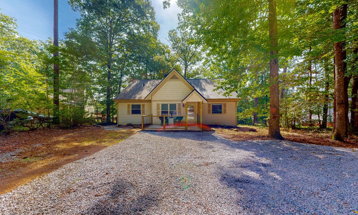 Sparta House | Inviting waterfront home with fireplace, dock, patio, central AC, & W/D