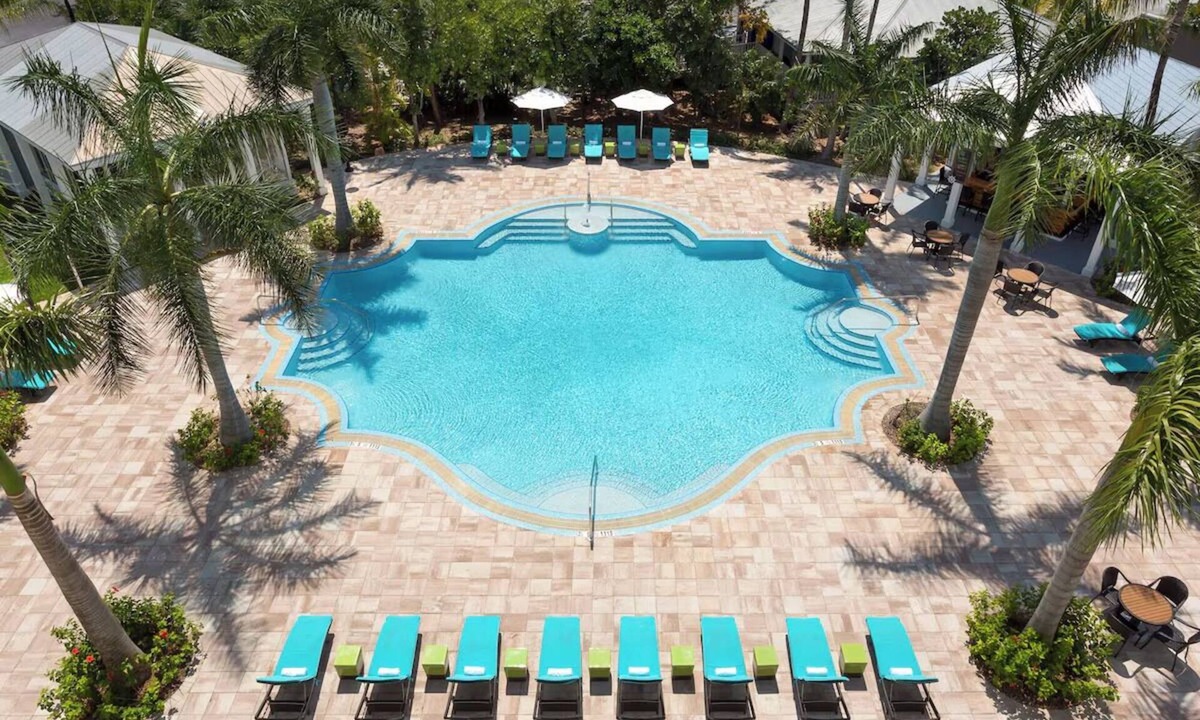 New Town Hotel | Laid-Back Luxe | Pools, Comfort Foods, Lawn Games & Shuttle to Fun