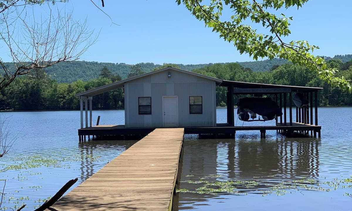 Fackler Apartment | Lake side apartment with shared 100’ pier and pavilion with rock BBQ pit.