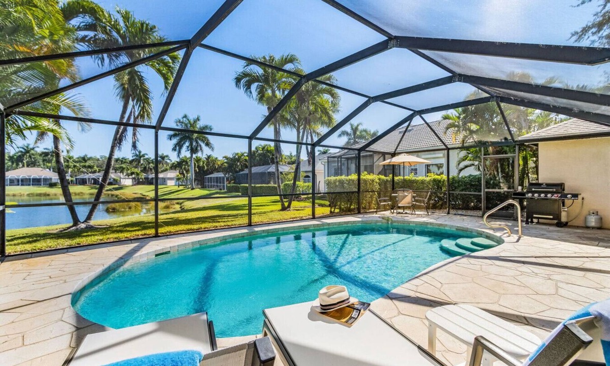 Central Naples House | Lazy days & lake views. Beautiful Naples pool home in Briarwood