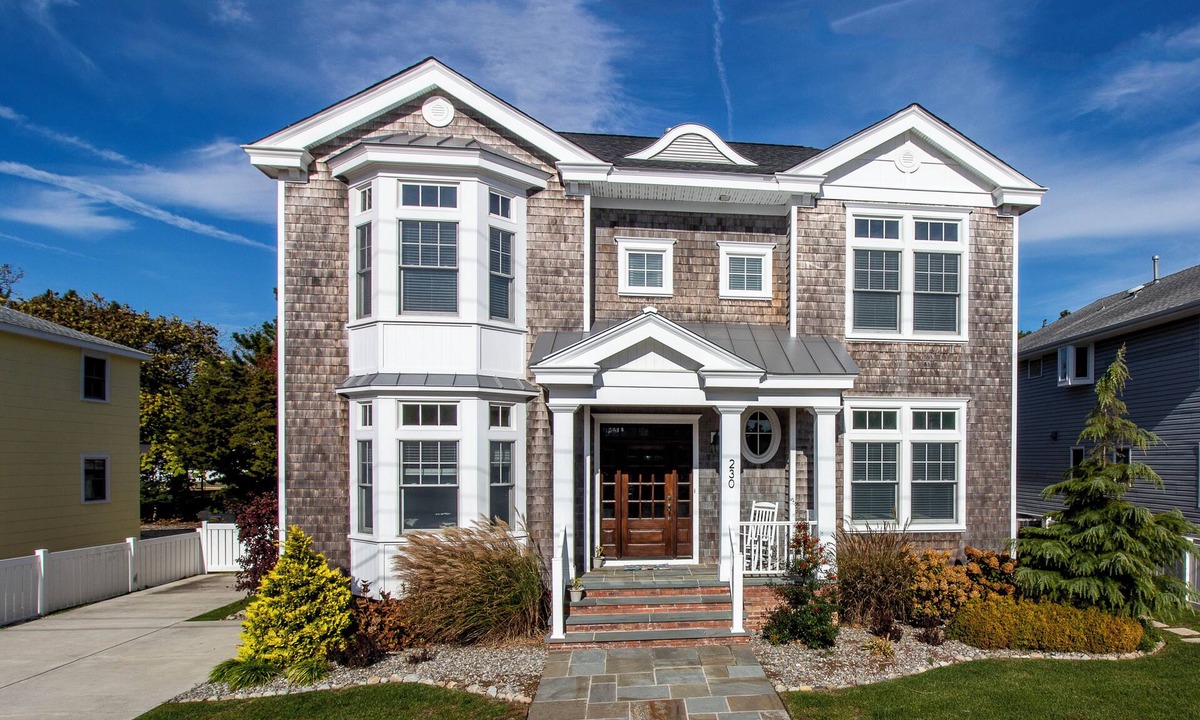 Stone Harbor House | Located just 1 ½ blocks to the beach, this distinctive property boasts seven (7) bedrooms, each with their own custom, private bath, as well as one powder room and an exquisite, solid mahogany, outdoor shower