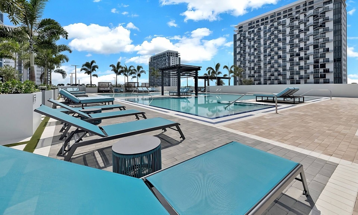 Doral Hotel | Modern 3BR City View Residence with Balcony and Luxury Amenities Near Downtown