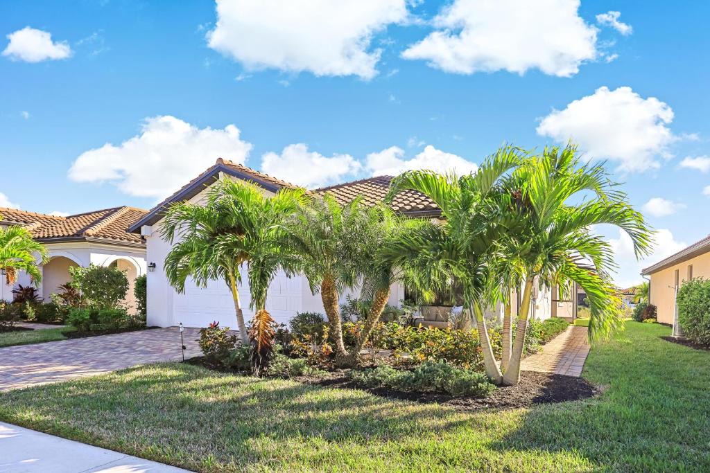 Naples House | Modern waterfront home in Artesia with pool/gym