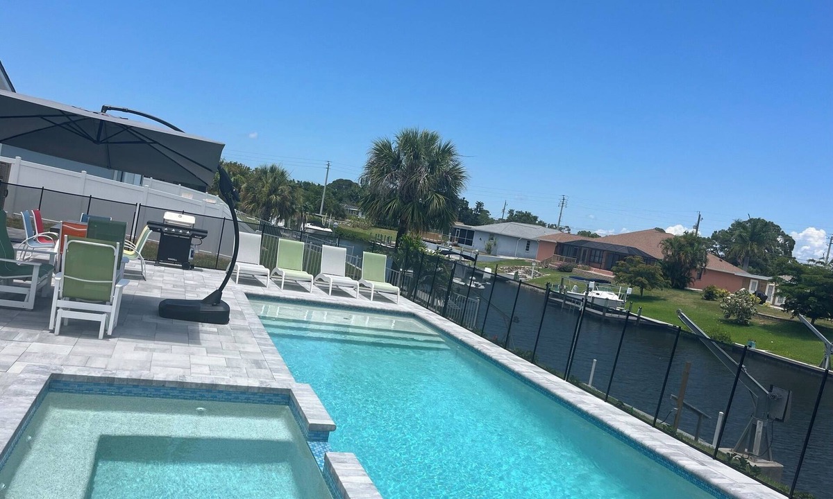 Englewood House | Newly Remodeled Waterfront Home with Heated Pool/Spa and Dock Close to Beach