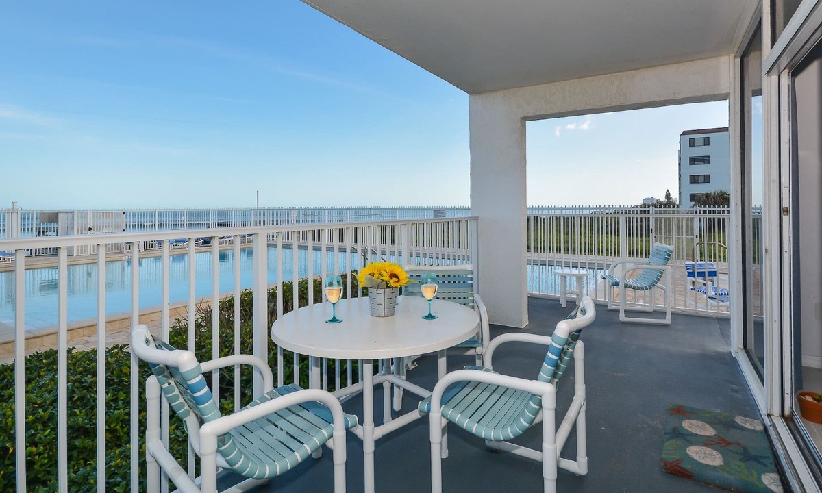 Bethune Beach Condo | Ocean Condo 104 ~ Ground Floor Corner Condo with wrap around balcony! Walk right out to Pool!