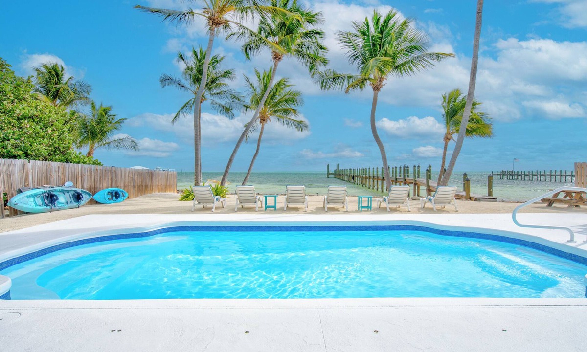 Tavernier House | Oceanfront Estate with Private 350 foot Pier, Heated Pool, Pet Friendly
