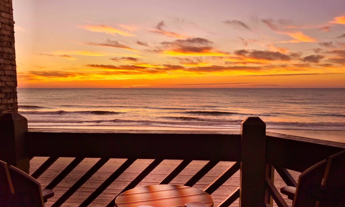 Garden City Condo | Oceanfront luxury meets easy coastal living. Enjoy miles of views, a king suite with balcony access, a 75″ TV, and an oversized fireplace all just steps from the ocean in beautiful Garden City Beach, SC. Oceanfront, with a pool and hot tub.