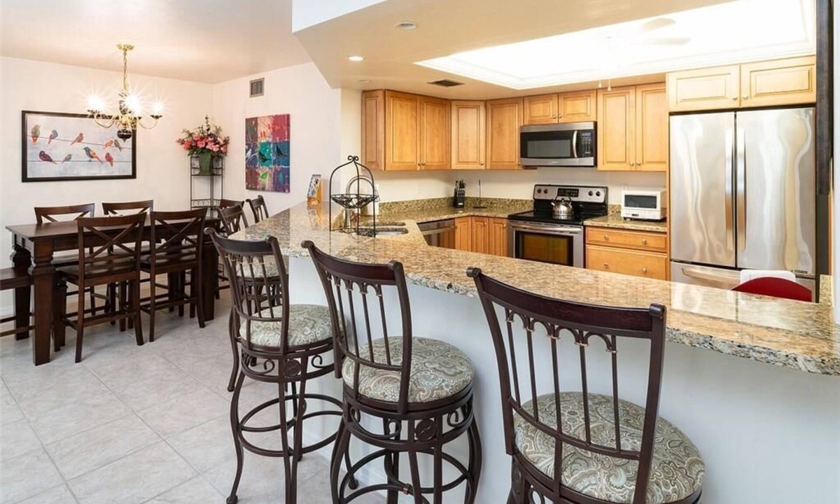 Pelican Bay Condo | Renovated Beachwalk 3 Bedroom Condo -5 minute walk to Beach!