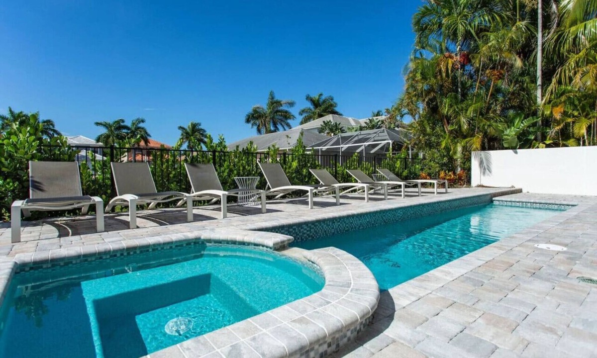 Naples Park House | Sorrento Luxury Vacation Home: Expansive 5-Bedroom, 4.5-Bath Retreat with Private Pool, Hot Tub and Pet-Friendly Accommodations. Just a Short Walk to the beach at Delnor-Wiggins State Park!
