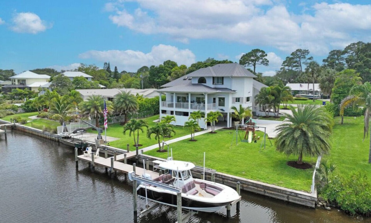 Palm City House | Stunning Water Front River House with Gourmet Kitchen & Large Boat Dock!