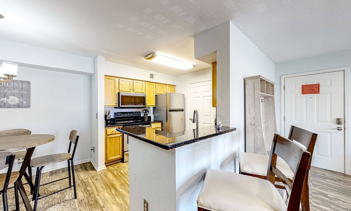 Indian Bayou Condo | Third-floor condo with balcony, pool, gym & central AC - 1/2 mile to the beach