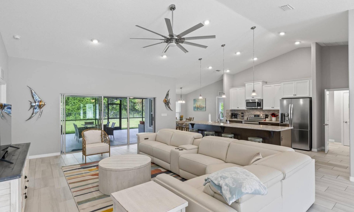 Palm Coast House | Tropical Bliss Waterfront Home | Palm Coast | Screened Lanai | Close To The Beach | Garage Access