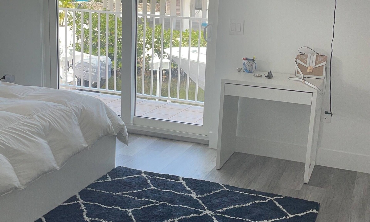 Long Key House | Water front property with bar, tennis, market place, and restaurants close by.
