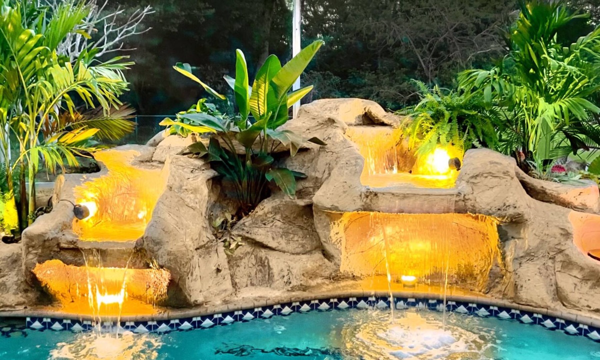 Pelican House | Waterfall saltwater Lagoon heated pool, 2 King Suites, Sauna!