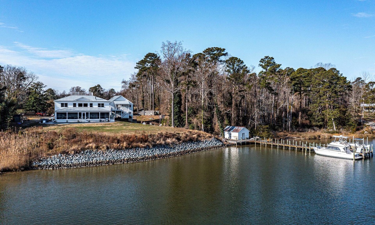 Wicomico Church House | Waterfront 4-bedroom homestead with pool, jacuzzi, and dock access. Sleeps 11!