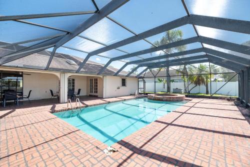 Tamarac House | Waterfront 5BR Home with Game room Pool Sleeps 10