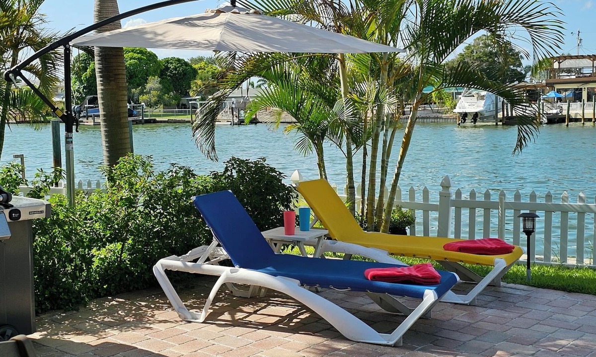 Indian Rocks Beach House | Waterfront Luxury Oasis - Steps to Beach n - Kayaks, Private Dock & Patio 🏖