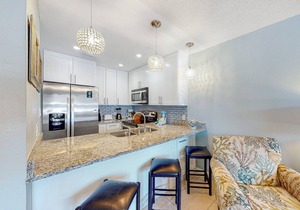 Beach-themed condo w/shared pool, easy beach access, patio & outdoor dining area