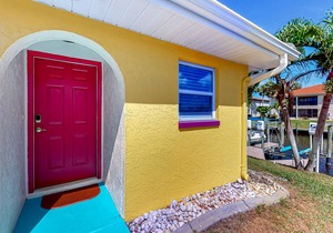 Canal-front condo with pool, boat slip, deck, central AC, & fast WiFi