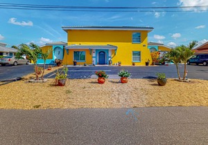 Canal-front condo with pool, boat slip, deck, central AC, & fast WiFi