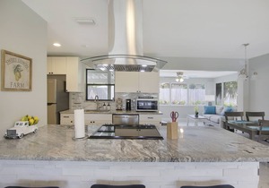 Coastal house in Juno beach with heated saltwater pool. Walk to the local beach.