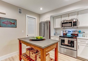Completely Remodeled Condo with Modern Kitchen & WiFi - Steps to Beach/Pool
