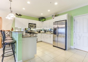 Dog Friendly! Nicely appointed 3 bedroom 3 bathroom townhome across the street from beach.