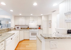 Dog-friendly oceanfront townhouse with covered balcony, views, pool & AC