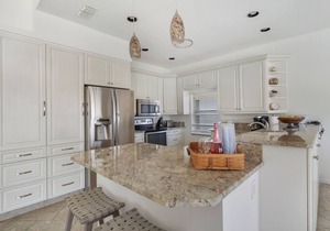 Enjoy Players Club Access in this Luxurious Naples Golf Course Home.