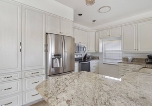 Enjoy Players Club Access in this Luxurious Naples Golf Course Home.