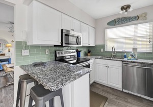 Flirty Flamingo Cottage Updated beach cottage, moments from the sand, w/pool!