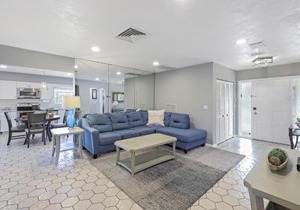 Home on water with pool/lanai kitchen/walk to beach