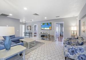 Home on water with pool/lanai kitchen/walk to beach