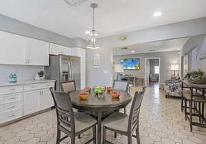 Home on water with pool/lanai kitchen/walk to beach