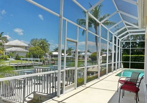Modern waterfront house with heated pool and view of converging waterways