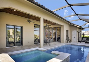 Picturesque waterfront home w/ heated pool, hot tub & outdoor kitchen