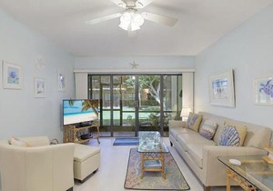 Relaxing condo with two pools and steps to beach