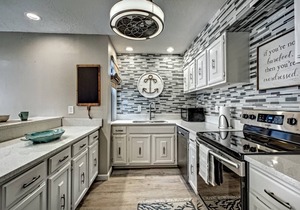 Renovated 2-Bedroom Condo | Walk to Beach | Heated Pool | Bay Views | Daily Free Activities