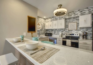 Renovated 2-Bedroom Condo | Walk to Beach | Heated Pool | Bay Views | Daily Free Activities