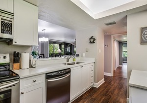 Spacious, air-conditioned condo with private W/D, beach shuttle, & central AC