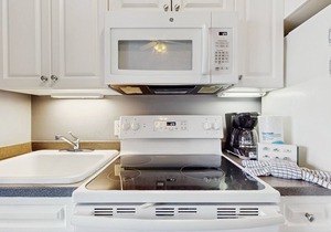 Spacious condo w/large living area, private balcony & shared pool